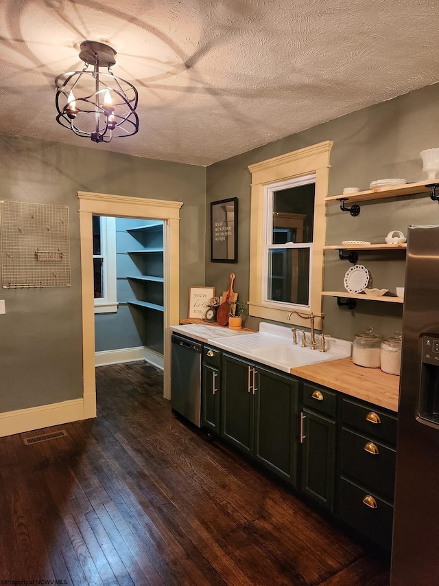 bathroom with a textured ceiling, wood-type flooring, vanity, and a notable chandelier