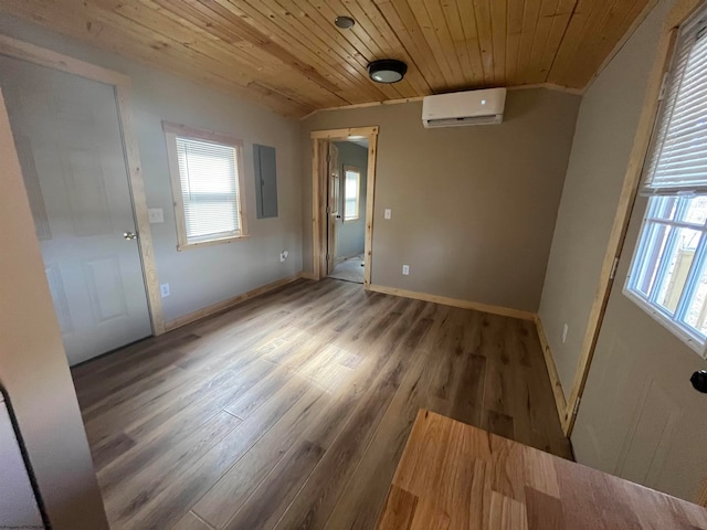 unfurnished room with dark hardwood / wood-style flooring, wood ceiling, electric panel, and an AC wall unit