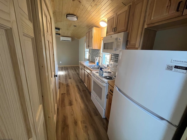 kitchen with sink, wooden ceiling, a wall unit AC, hardwood / wood-style floors, and white appliances