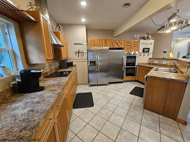 kitchen with range hood, a chandelier, light tile floors, stainless steel appliances, and sink