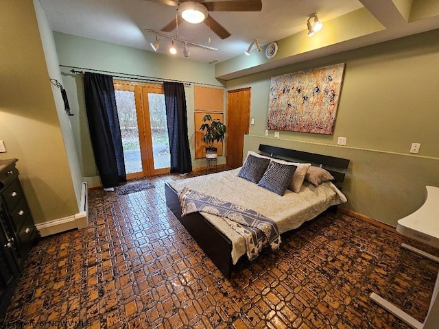 tiled bedroom featuring ceiling fan, track lighting, and access to outside