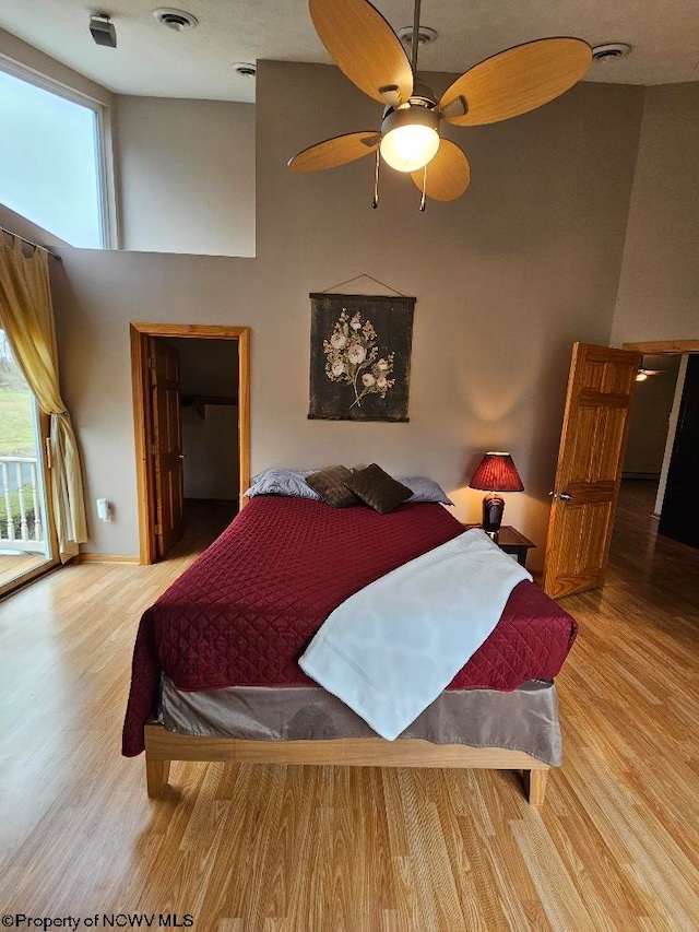 bedroom featuring ceiling fan and light wood-type flooring