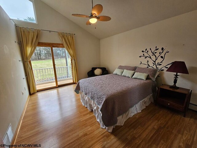 bedroom with ceiling fan, access to outside, high vaulted ceiling, and hardwood / wood-style floors