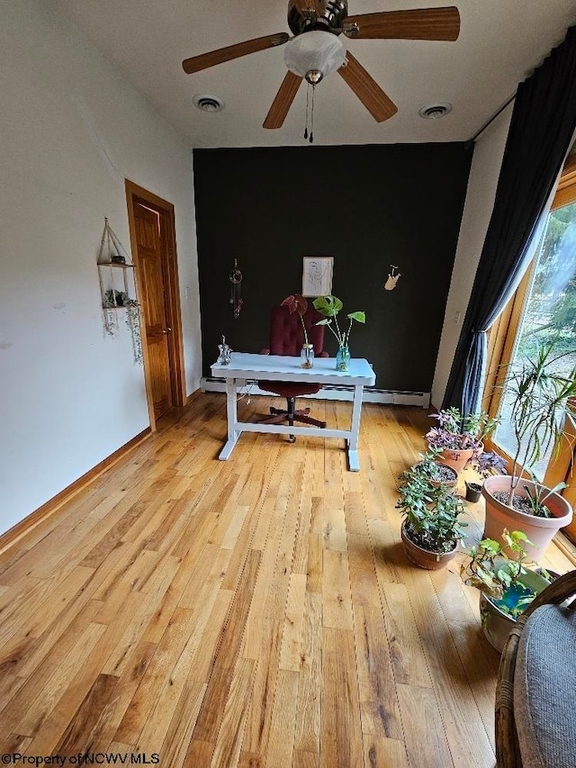 interior space featuring ceiling fan and light wood-type flooring