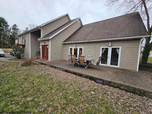 back of house featuring a patio and french doors