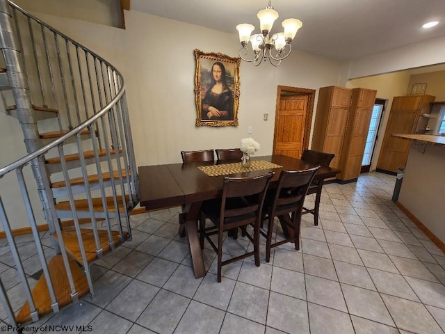 tiled dining area featuring a chandelier