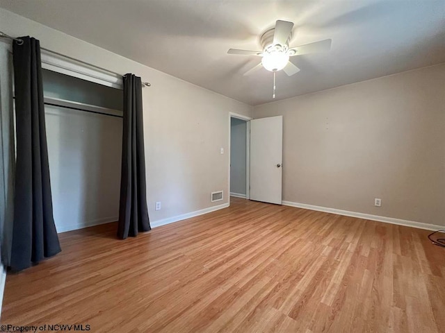 unfurnished bedroom featuring ceiling fan and light wood-type flooring