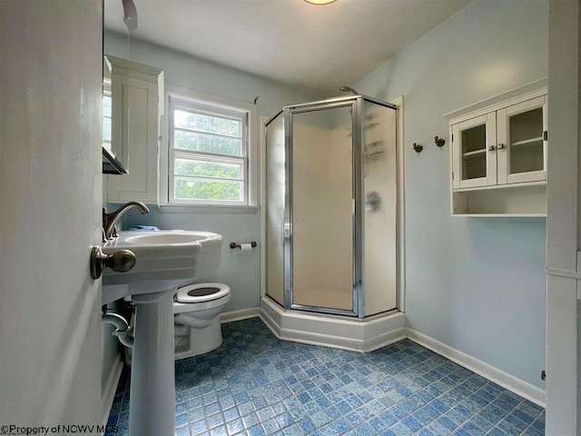 bathroom with walk in shower, tile flooring, and toilet