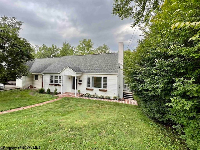 ranch-style house featuring a front lawn