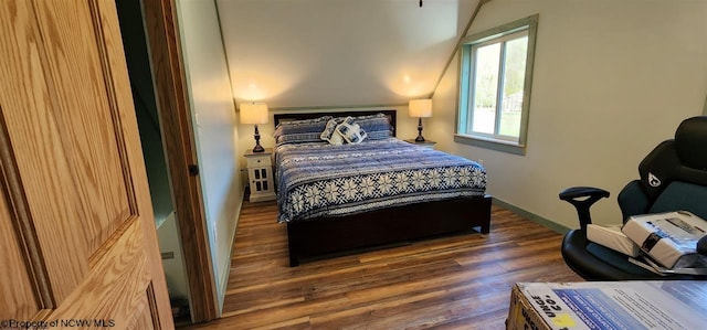 bedroom with dark wood-type flooring