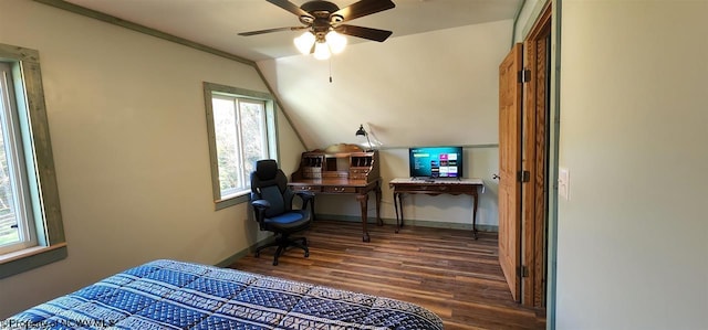 bedroom with dark hardwood / wood-style flooring, ceiling fan, and vaulted ceiling