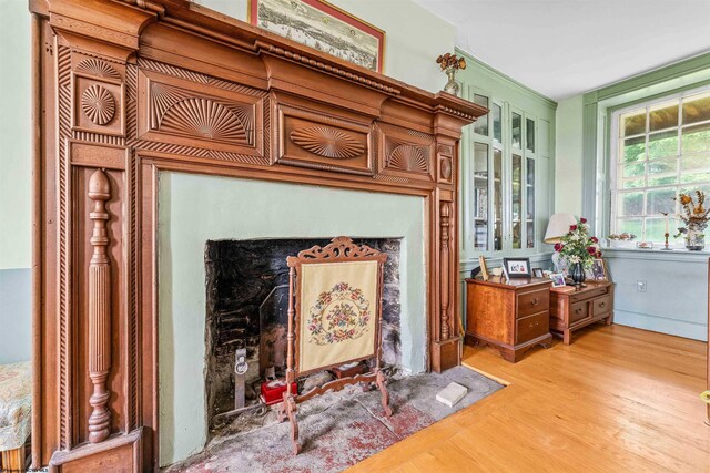 interior space with light hardwood / wood-style floors, vanity, and a fireplace