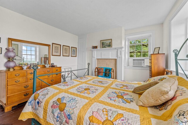 bedroom with a tiled fireplace