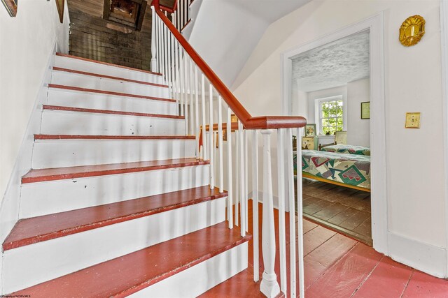 stairs with light tile floors