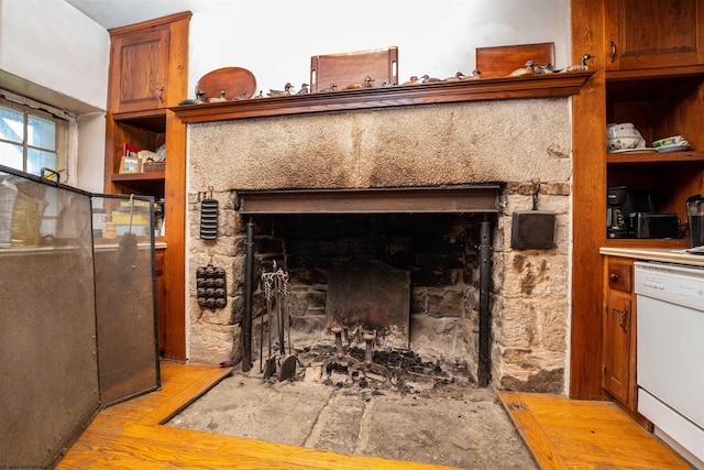 interior details with white dishwasher and light wood-type flooring