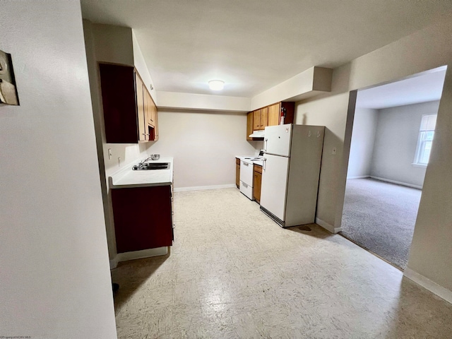 kitchen with white appliances and sink