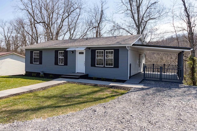 ranch-style home with a front lawn