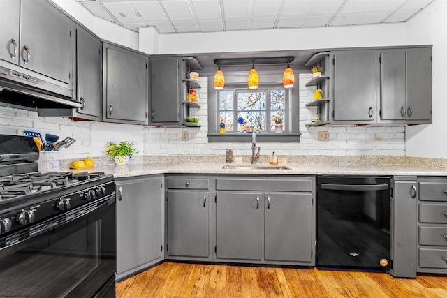 kitchen with gray cabinets, sink, light wood-type flooring, and black appliances