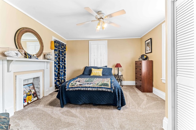 carpeted bedroom featuring ceiling fan and ornamental molding