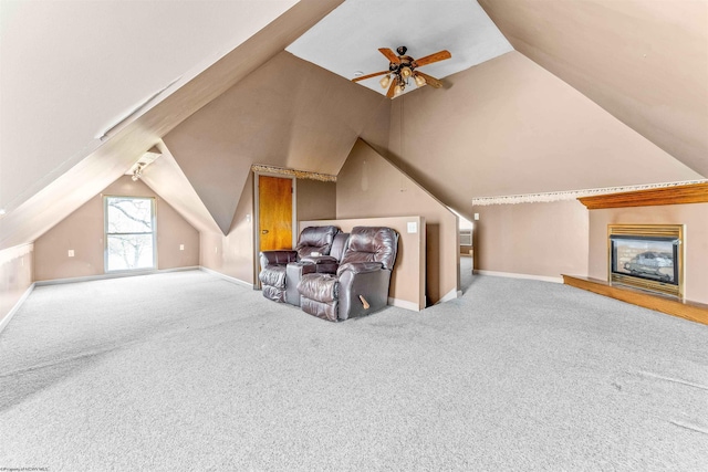 bonus room with light carpet, ceiling fan, and lofted ceiling