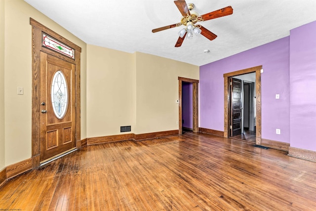 foyer entrance featuring ceiling fan and dark hardwood / wood-style flooring