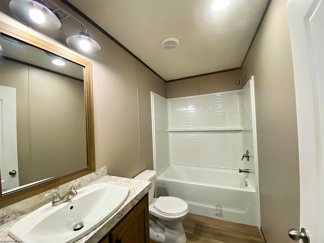 full bathroom featuring shower / tub combination, wood-type flooring, toilet, and vanity