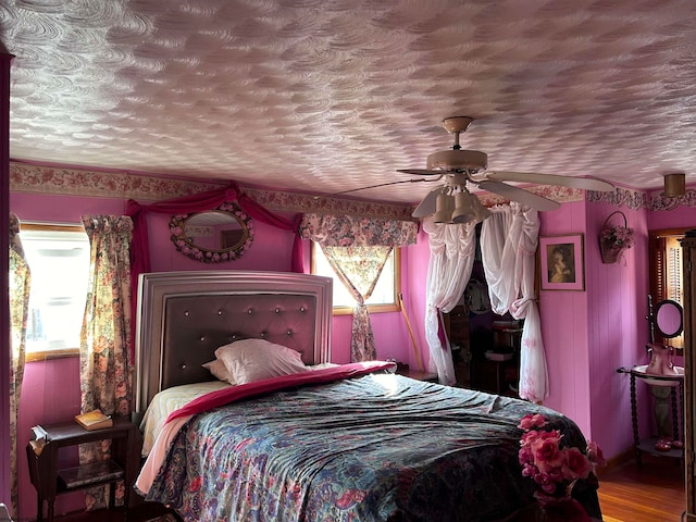 bedroom featuring hardwood / wood-style floors and ceiling fan