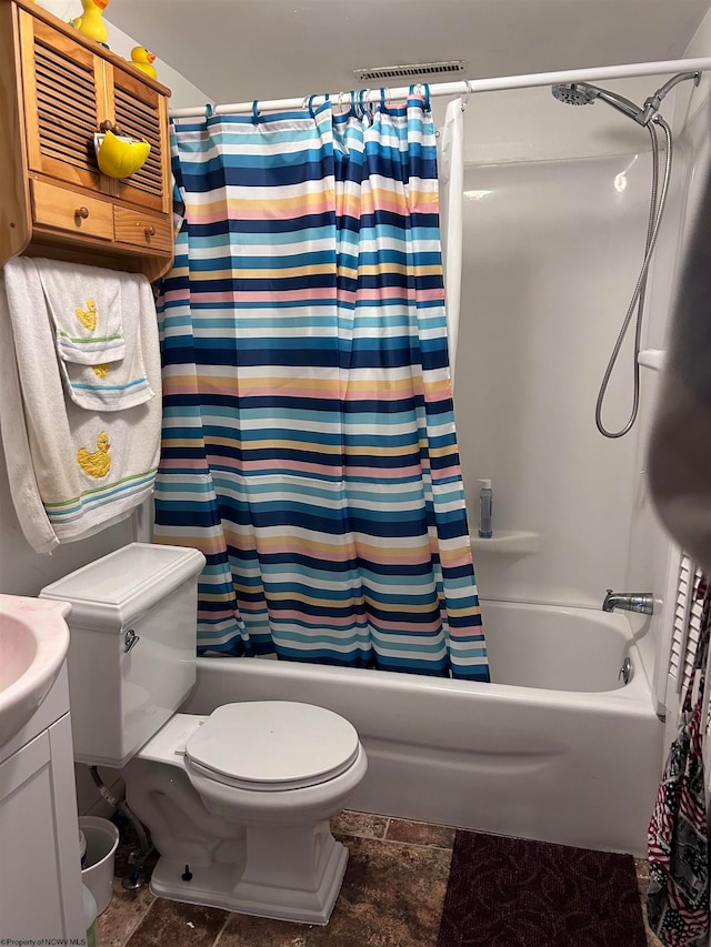 full bathroom with shower / bath combo, toilet, and tile flooring