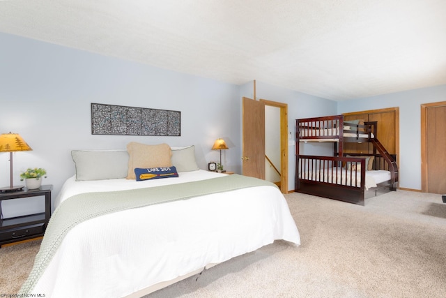 bedroom with light colored carpet