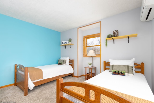 carpeted bedroom featuring a wall mounted air conditioner and a textured ceiling