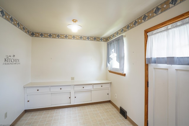 spare room with light tile flooring