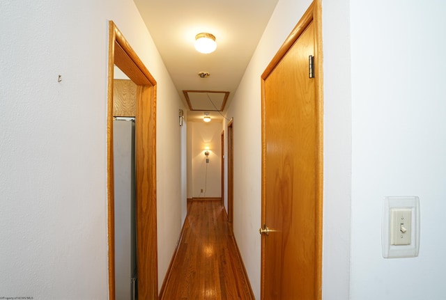 hallway with light hardwood / wood-style flooring