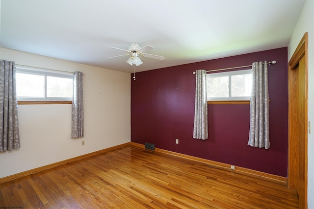 spare room with ceiling fan and light hardwood / wood-style floors