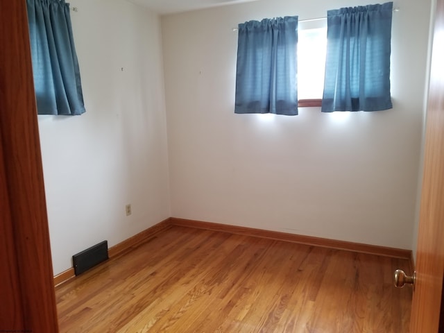 empty room with light wood-type flooring