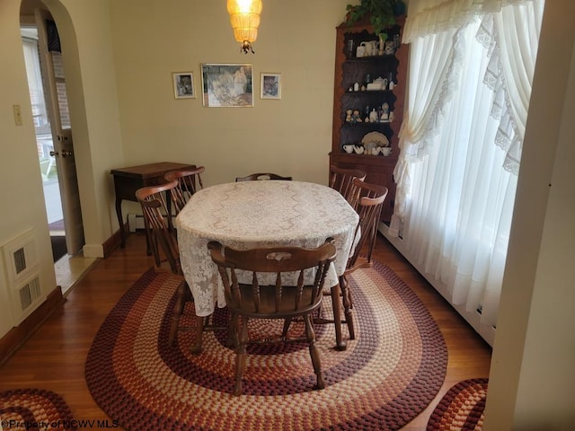 dining room with dark wood-type flooring