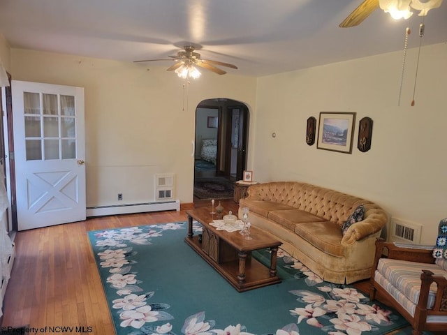 living room featuring ceiling fan, a baseboard radiator, and light hardwood / wood-style floors