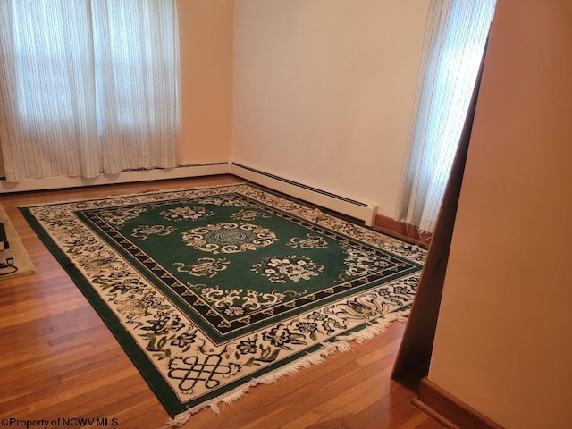 unfurnished room featuring hardwood / wood-style floors