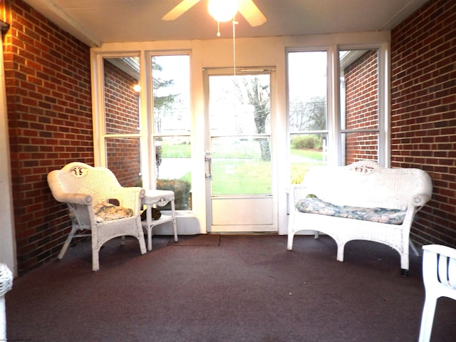 sunroom / solarium with ceiling fan