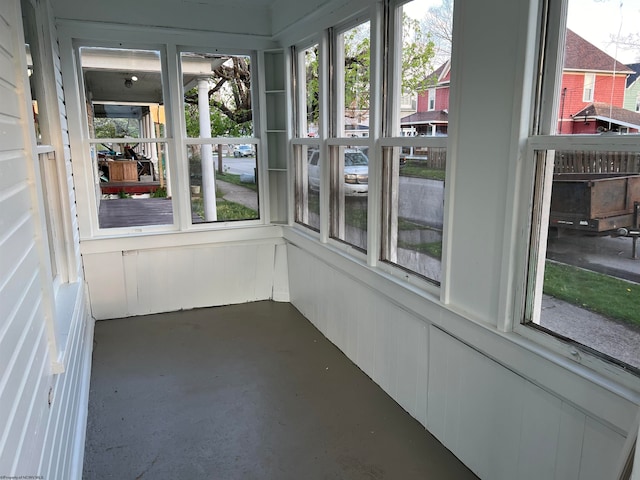 unfurnished sunroom with a wealth of natural light