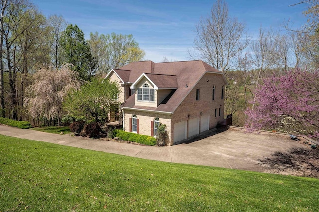 view of front of home featuring a garage and a front lawn