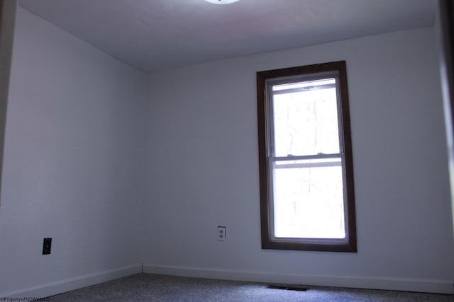 empty room featuring carpet flooring