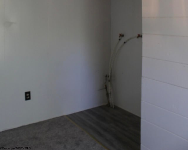 spare room featuring dark hardwood / wood-style floors