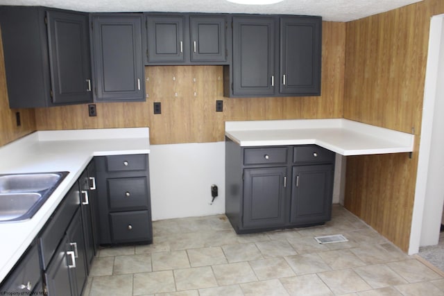 kitchen featuring sink and a textured ceiling