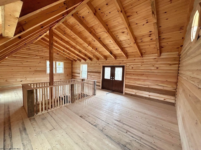 bonus room with lofted ceiling with beams, french doors, wooden ceiling, log walls, and light hardwood / wood-style floors