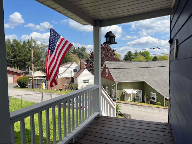 wooden deck featuring a garage