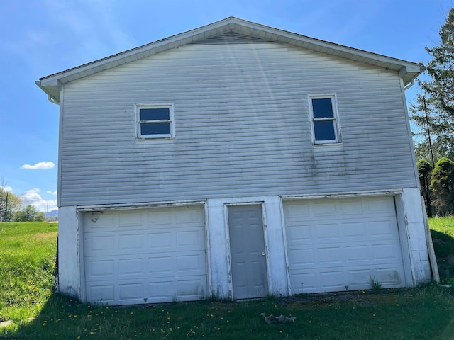 view of side of home featuring a garage