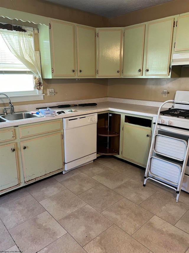 kitchen featuring light tile floors, extractor fan, white appliances, and sink