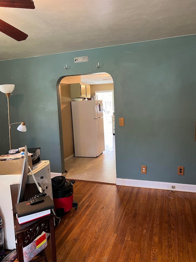 interior space featuring tile floors and ceiling fan