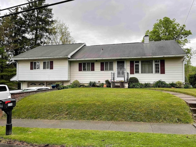 view of front of property with a front lawn