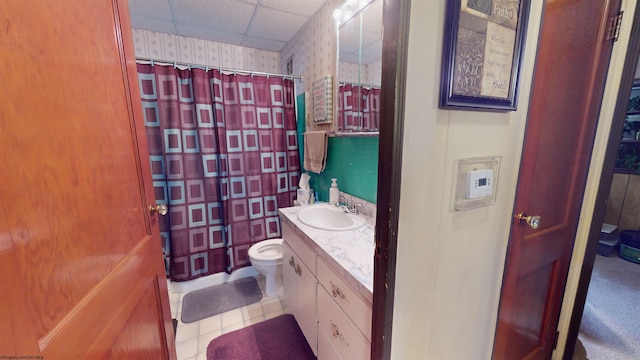 bathroom featuring oversized vanity, tile floors, and toilet